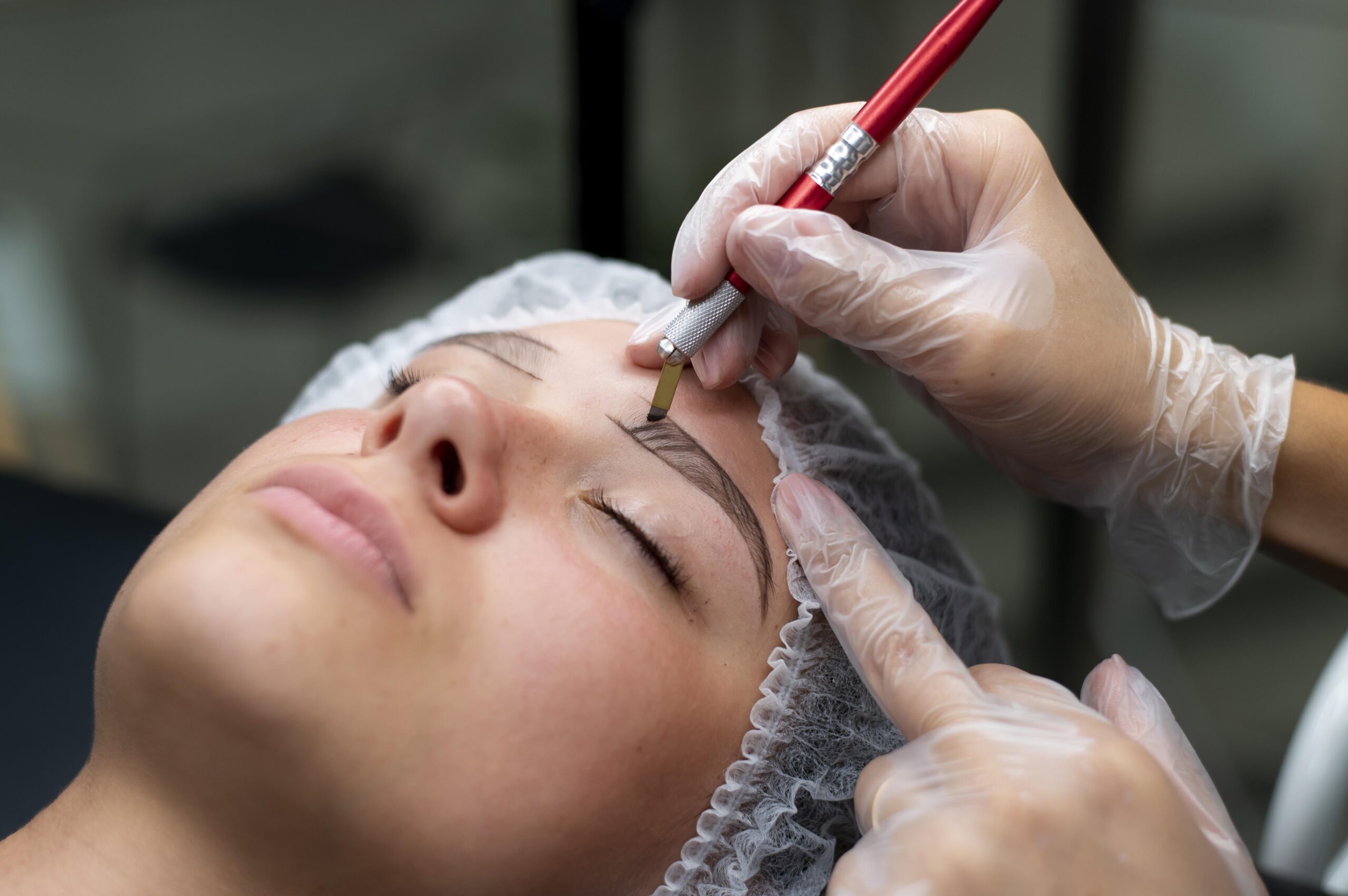 beautician-doing-microblading-procedure-young-woman